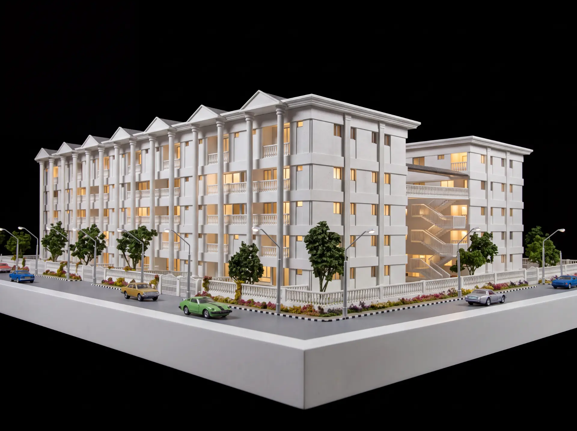 Community residence scale model with classical colonnade facade, landscaping and street scene