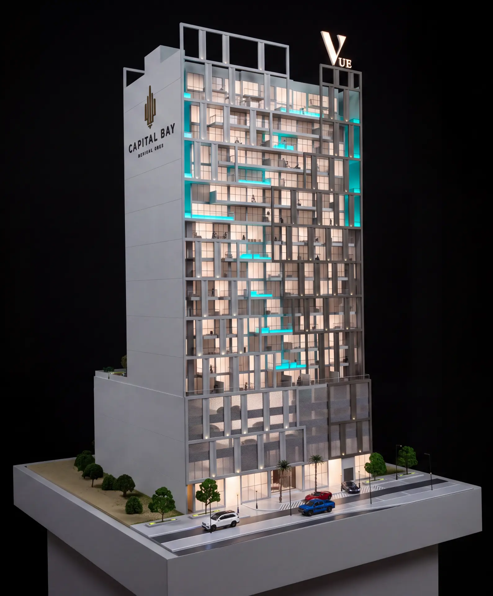Capital Bay tower scale model with lit interior floors, street landscaping and model vehicles