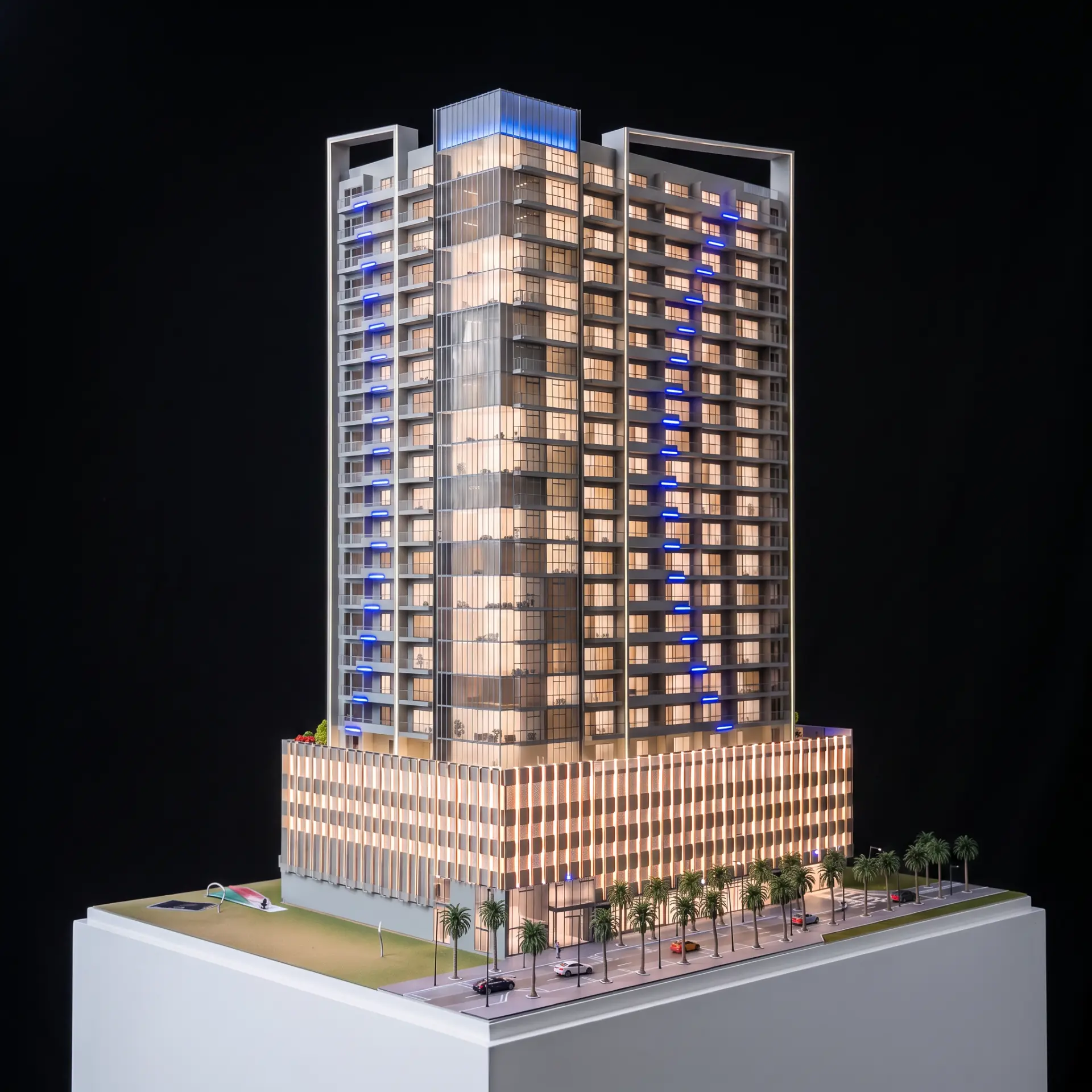 Twin residential towers scale model with blue accent lighting
