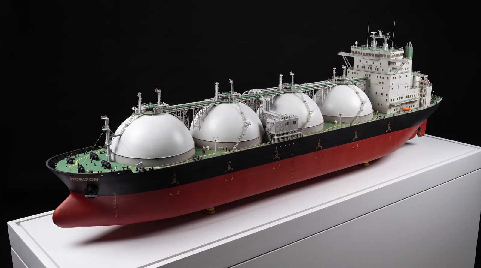 LNG carrier ship scale model with four spherical tanks on a display plinth